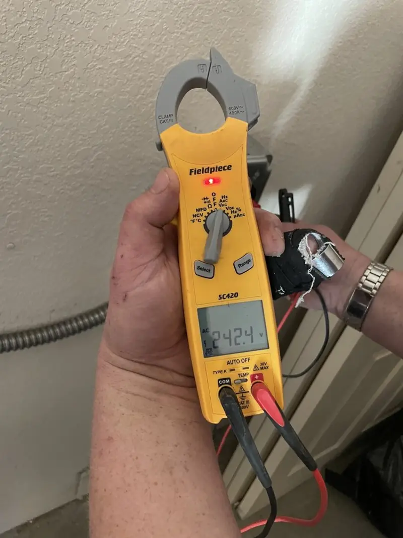Voltage testing with clamp meter during Electrical Installation Services in Whitesboro